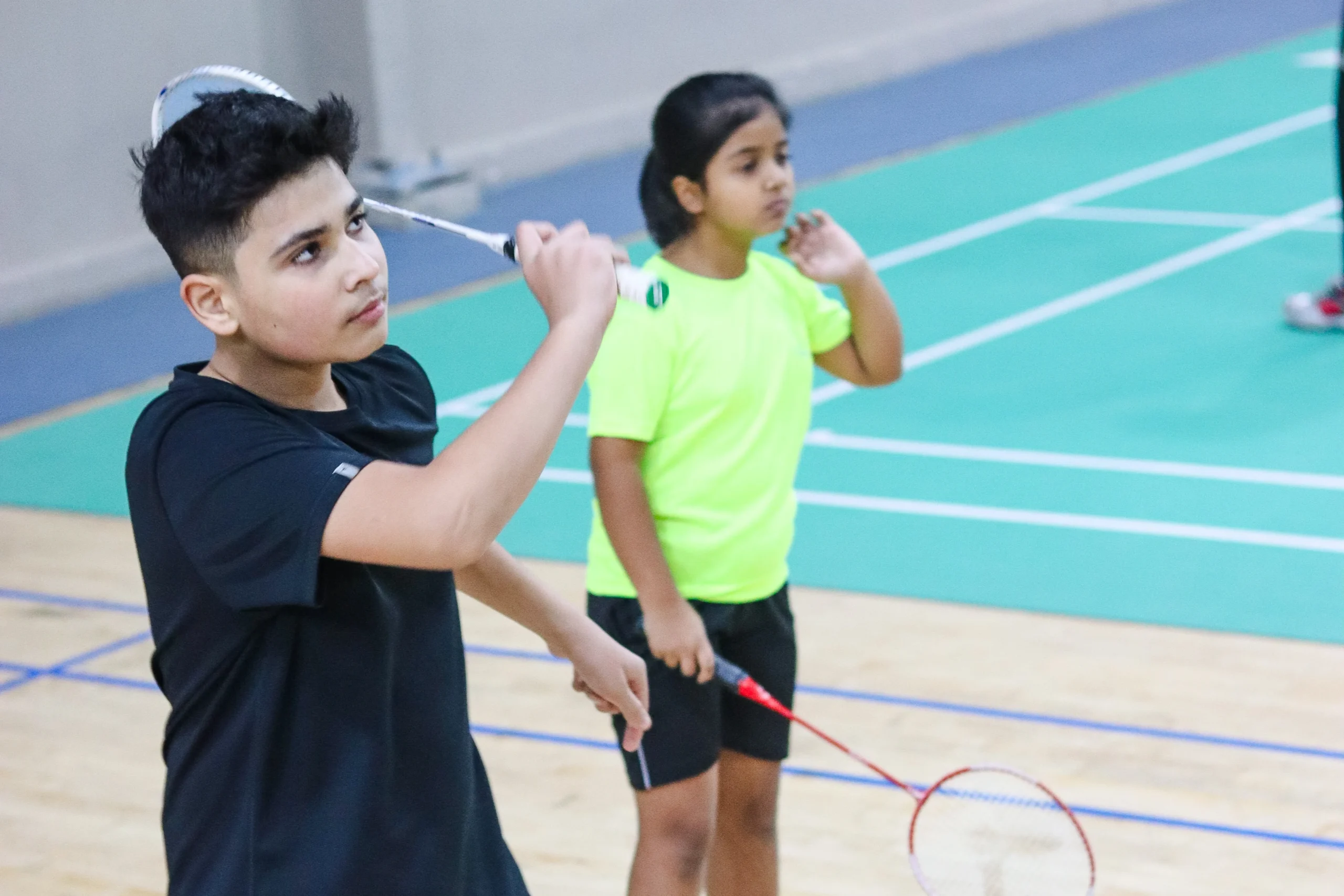 Badminton players exercise